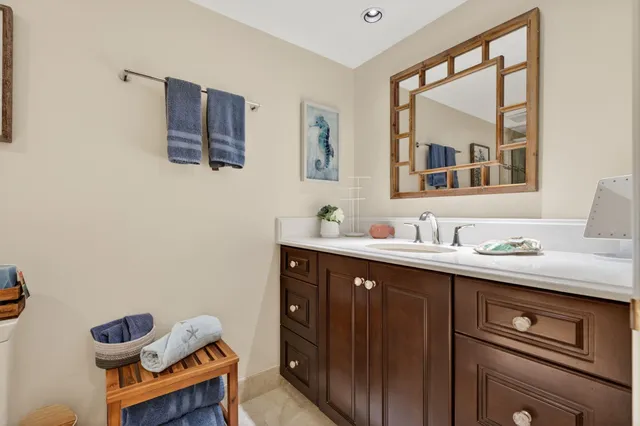 a spacious bedroom with a bed and glass window