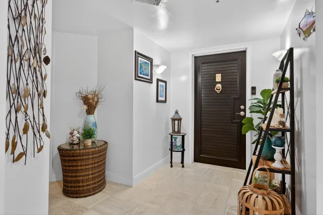 a bathroom with a granite countertop sink toilet a mirror a vanity and shower