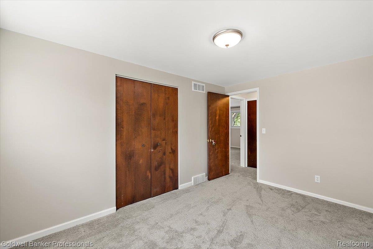 78 Carter Avenue Troy, MI 48098 - Photo 29 of 52 Unfurnished bedroom featuring carpet and a closet