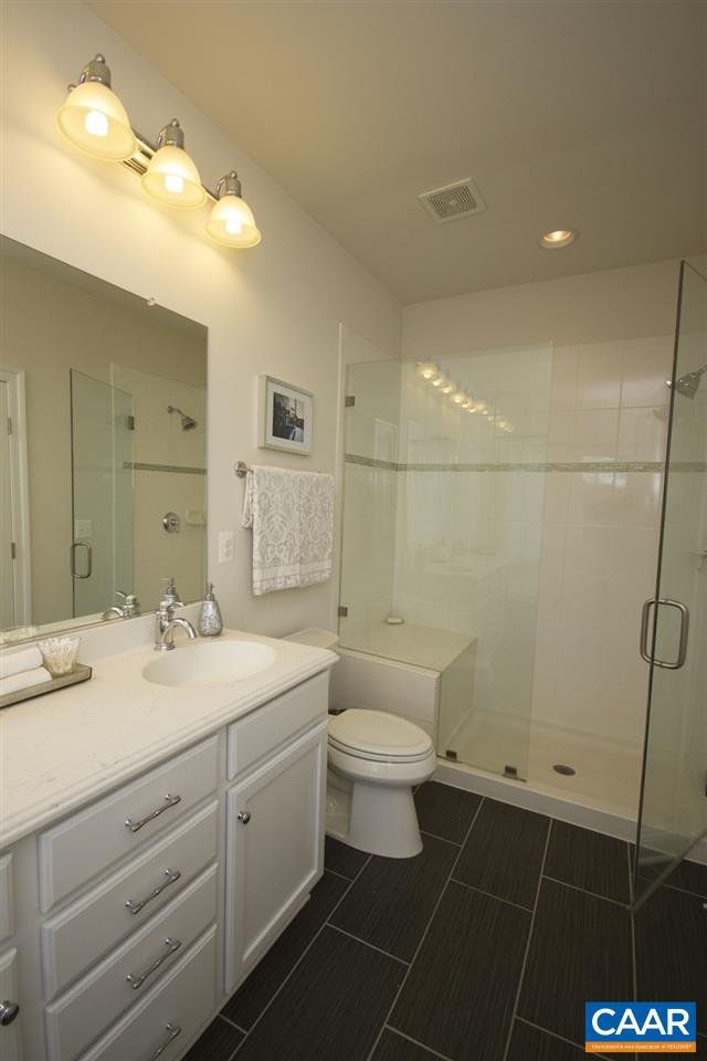2018 Avinity Loop Charlottesville, VA 22902 - Photo 15 of 25 a bathroom with a double vanity sink toilet and a mirror