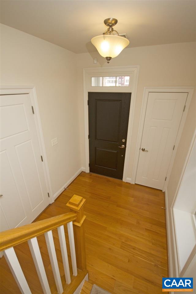 2018 Avinity Loop Charlottesville, VA 22902 - Photo 21 of 25 a view of a room with wooden floor and chandelier