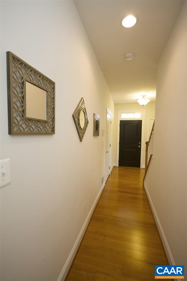 2018 Avinity Loop Charlottesville, VA 22902 - Photo 24 of 25 a view of a hallway with wooden floor