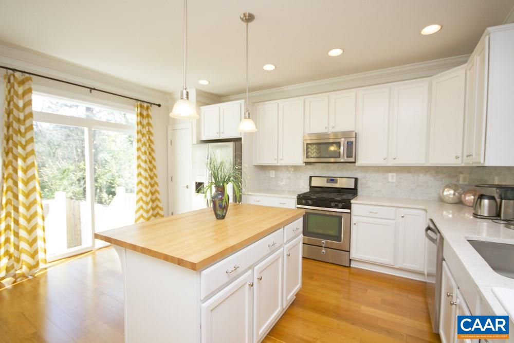 2018 Avinity Loop Charlottesville, VA 22902 - Photo 3 of 25 a kitchen with a stove a sink and a refrigerator