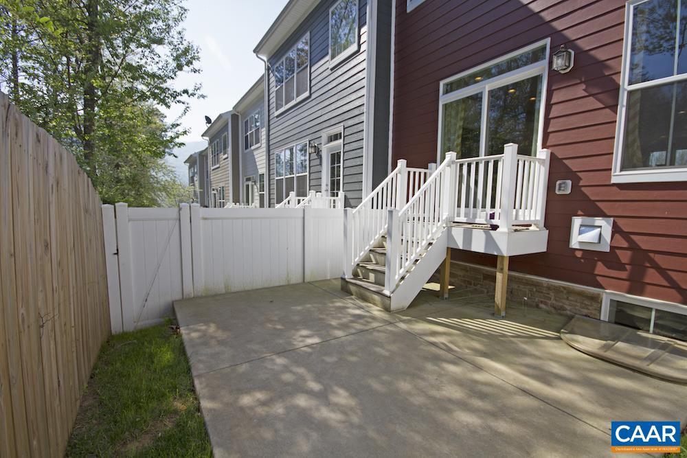 2018 Avinity Loop Charlottesville, VA 22902 - Photo 5 of 25 a view of a chair and table in backyard of the house