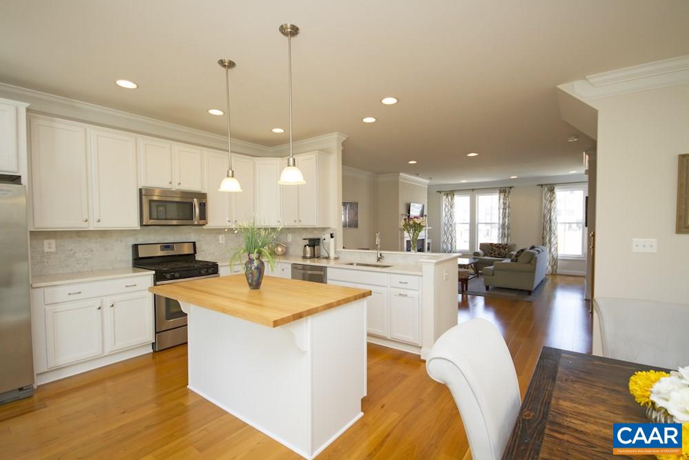 2018 Avinity Loop Charlottesville, VA 22902 - Photo 6 of 25 a view of a kitchen with kitchen island and stainless steel appliances