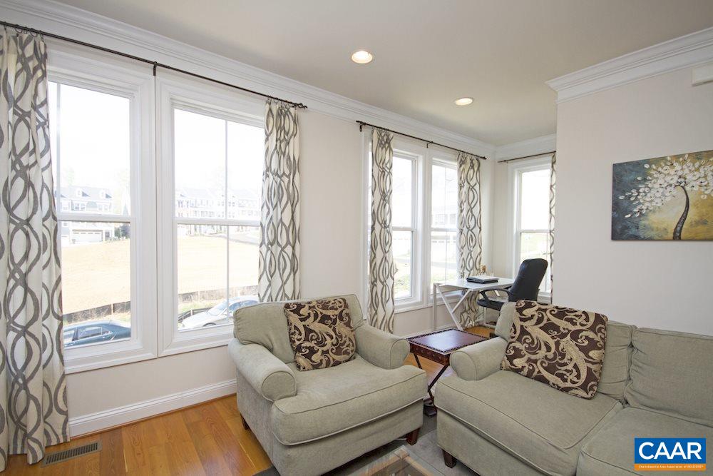 2018 Avinity Loop Charlottesville, VA 22902 - Photo 9 of 25 a living room with furniture and a large window