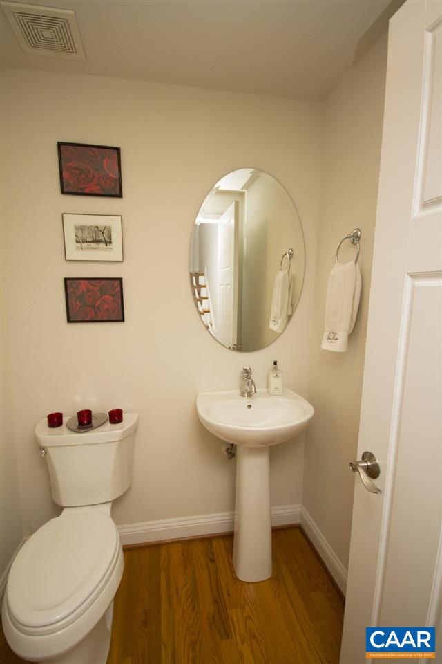 2018 Avinity Loop Charlottesville, VA 22902 - Photo 10 of 25 a white toilet sitting next to a bathroom sink