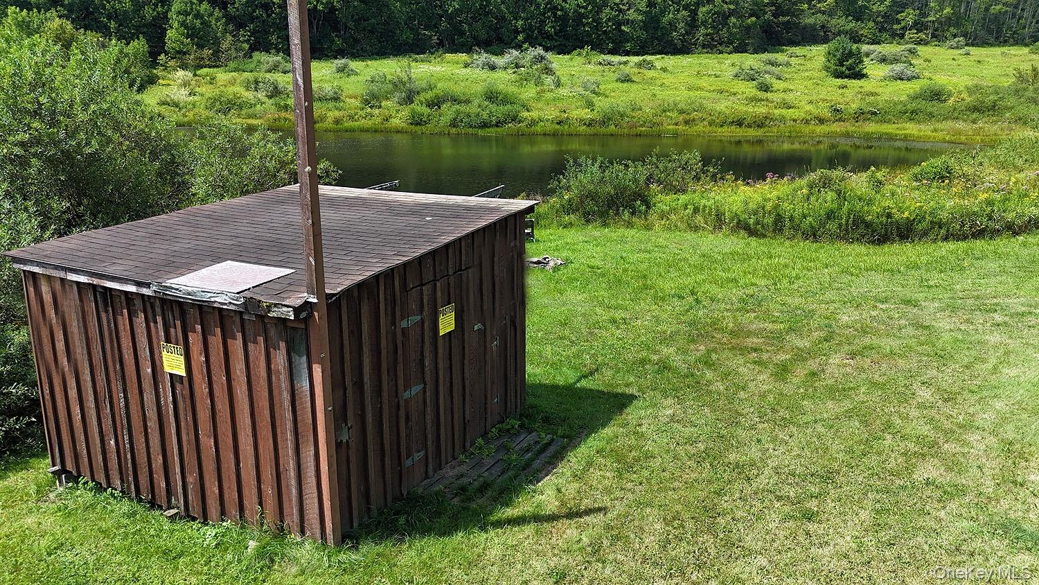 3392 Eminence Road Hancock, NY 12760 - Photo 41 of 43 a backyard of a house with lots of green space