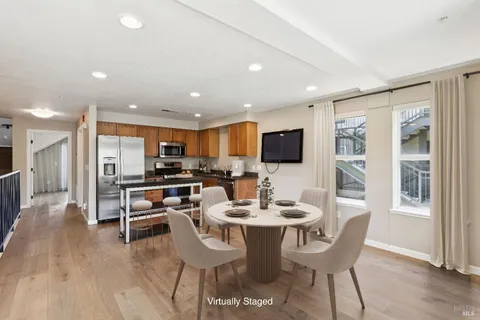 a view of a dining room with furniture window and wooden floor