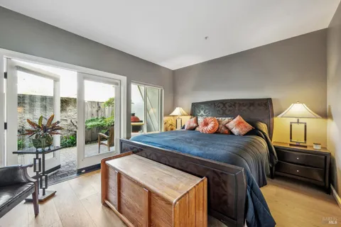 a bedroom with a bed and a night stand