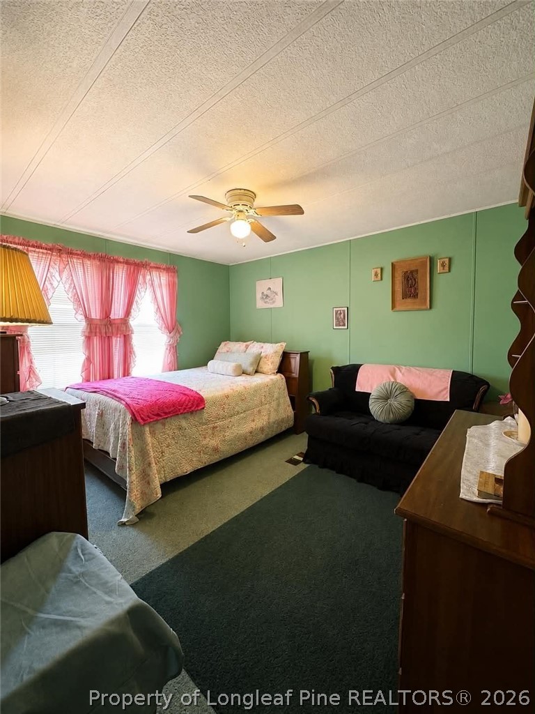 4435 Tartt's Mill Road Wilson, NC 27893 - Photo 15 of 23 a bedroom with a bed and window