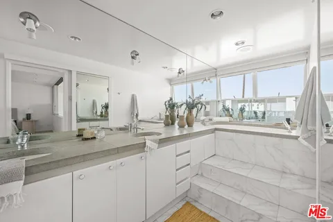 a kitchen with sink and cabinets