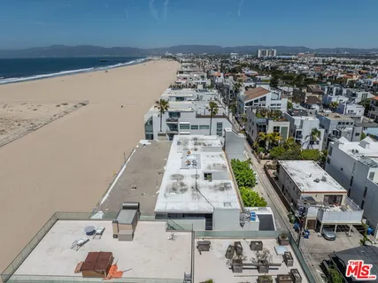 an aerial view of a building with a street