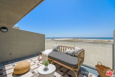 a living room with furniture and a chair