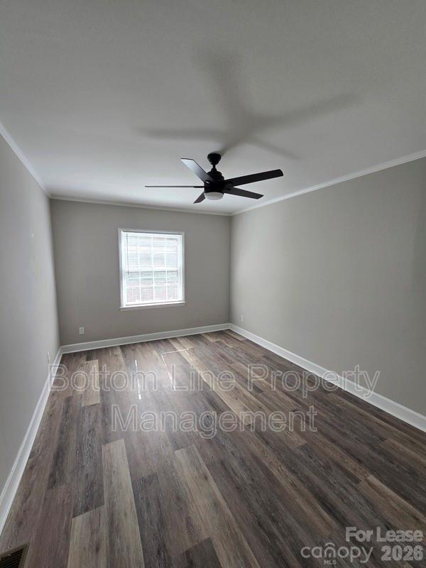 5949 Quail Hollow Road, Unit D Charlotte, NC 28210 - Photo 18 of 34 wooden floor in an empty room with a window