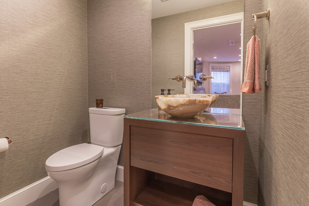 50 Rutland Square, Unit 1 Boston, MA 02118 - Photo 6 of 12 a bathroom with a toilet a sink and mirror