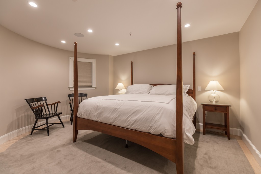 50 Rutland Square, Unit 1 Boston, MA 02118 - Photo 7 of 12 a spacious bedroom with a bed a table and chair