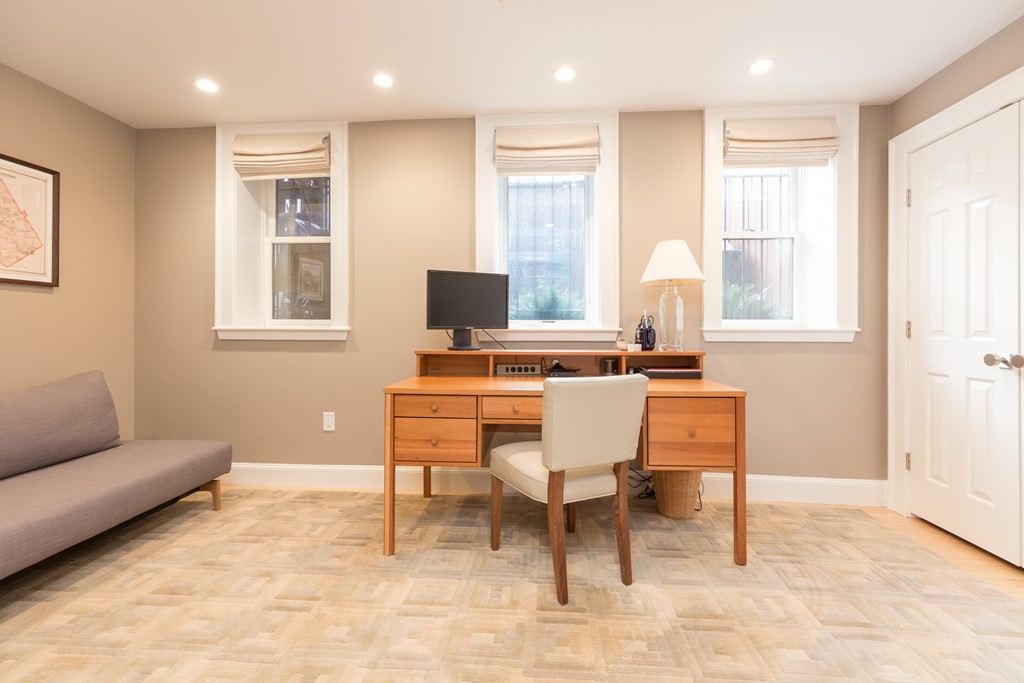 50 Rutland Square, Unit 1 Boston, MA 02118 - Photo 10 of 12 a living room with furniture a dining table and a window