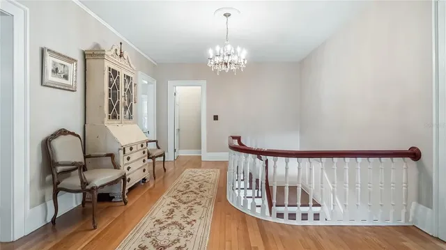 a view of a bedroom and wooden floor