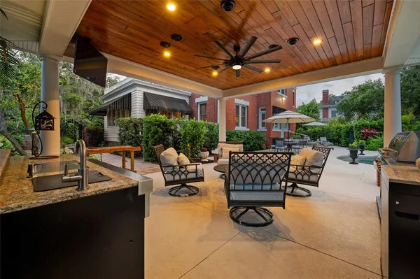 a building outdoor space with patio furniture and potted plants