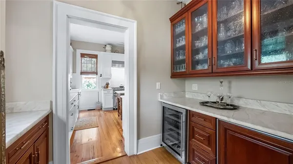a view of a kitchen from the kitchen and a window