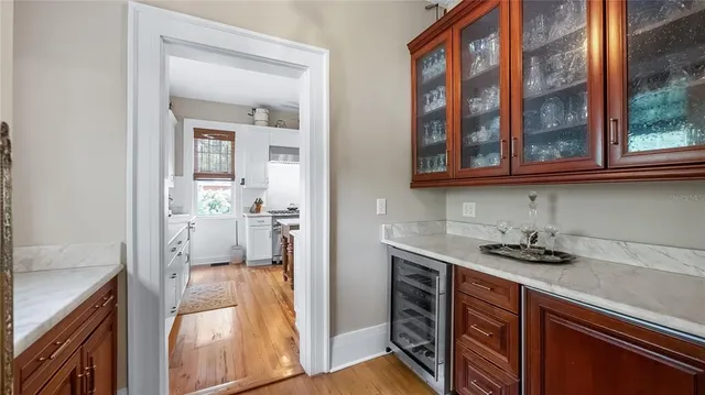 a view of a kitchen from the kitchen and a window