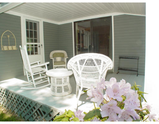 192 Holt Road Andover, MA 01810 - Photo 21 of 24 a front view of a house with table and chairs