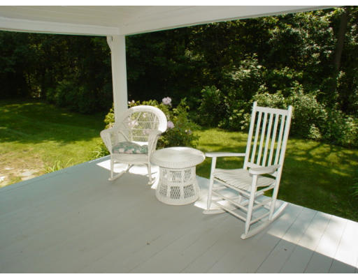 192 Holt Road Andover, MA 01810 - Photo 22 of 24 a view of a chair and table in backyard of the house