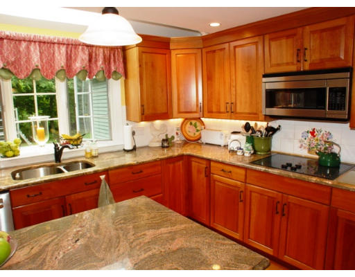 192 Holt Road Andover, MA 01810 - Photo 3 of 24 a kitchen with stainless steel appliances granite countertop a sink dishwasher cabinets and a computer on the desk