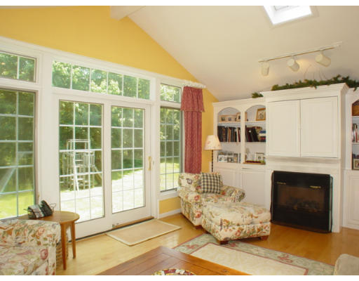 192 Holt Road Andover, MA 01810 - Photo 7 of 24 a living room with furniture window and a fireplace