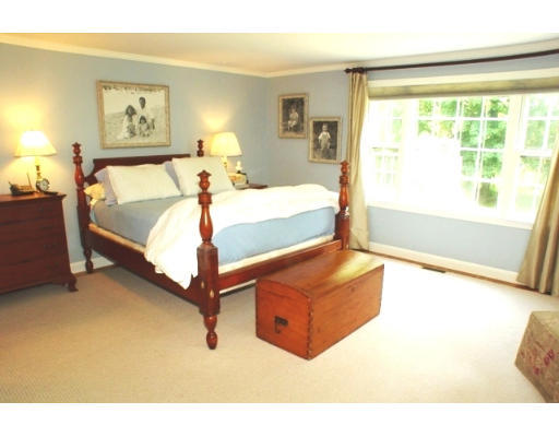 192 Holt Road Andover, MA 01810 - Photo 10 of 24 a bed room with a bed and a chair