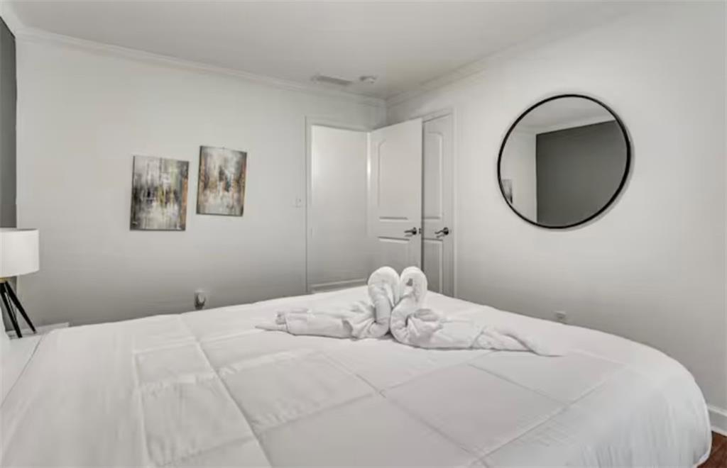 4050 Washington Road East Point, GA 30344 - Photo 16 of 58 a bedroom with a bed and a painting on the wall