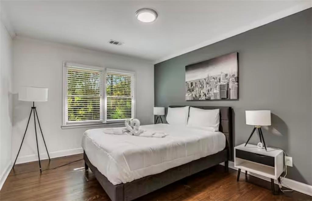 4050 Washington Road East Point, GA 30344 - Photo 17 of 58 a bedroom with a bed and a night stand