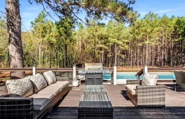 a bedroom with a large bed and a large window