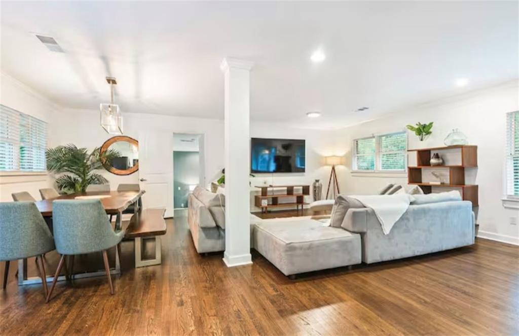 4050 Washington Road East Point, GA 30344 - Photo 22 of 58 a living room with fireplace furniture and a wooden floor