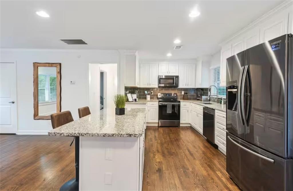 4050 Washington Road East Point, GA 30344 - Photo 31 of 58 a kitchen with stainless steel appliances granite countertop a refrigerator stove microwave and sink