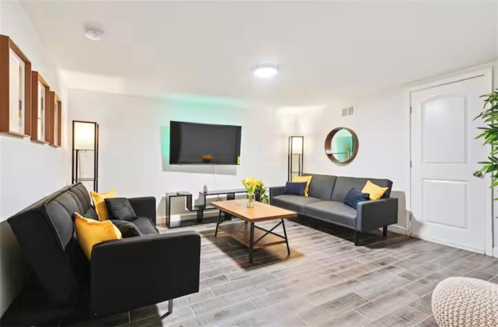 4050 Washington Road East Point, GA 30344 - Photo 41 of 58 a living room with furniture and a flat screen tv