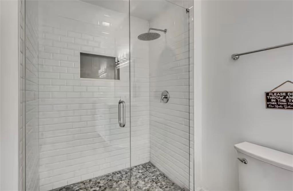 4050 Washington Road East Point, GA 30344 - Photo 47 of 58 a bathroom with a shower and a toilet