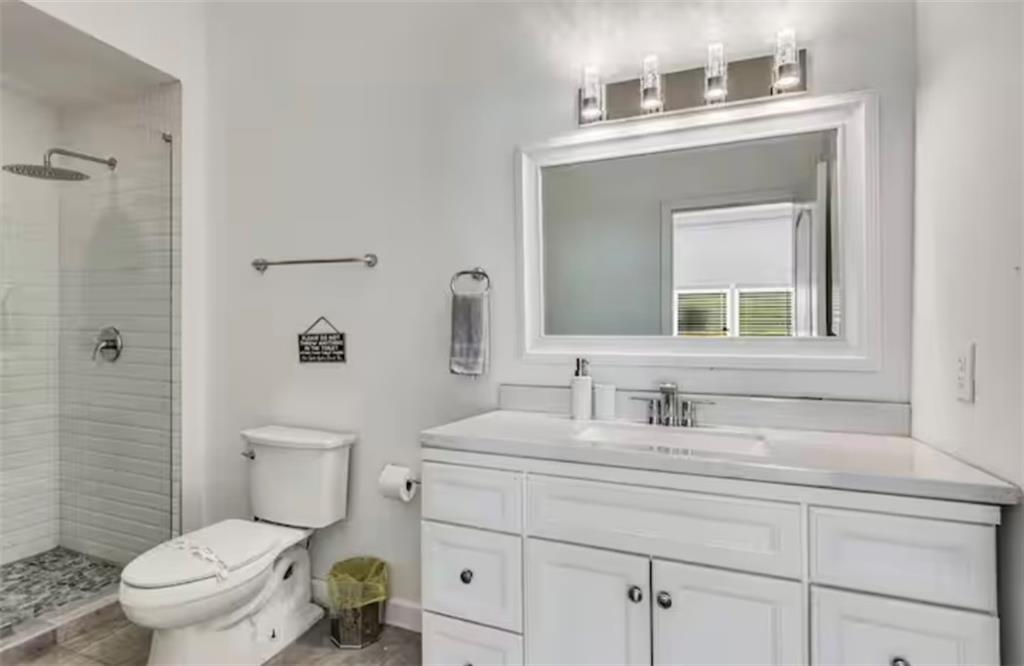 4050 Washington Road East Point, GA 30344 - Photo 48 of 58 a bathroom with a toilet sink and mirror