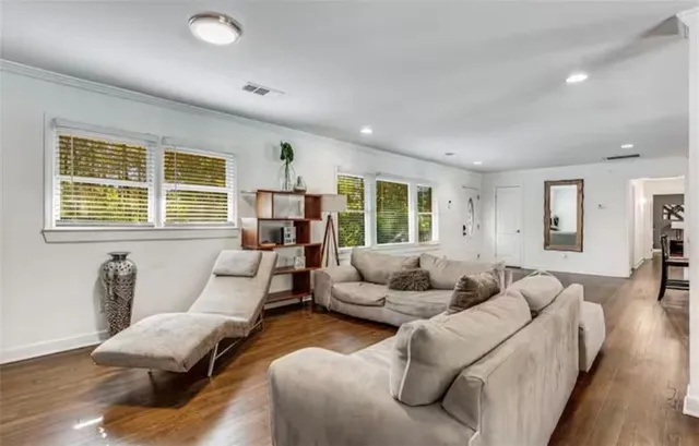 a large white bed in a white room