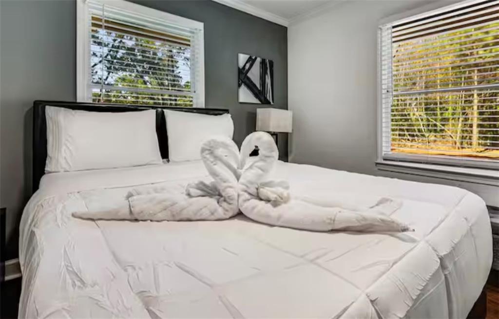 4050 Washington Road East Point, GA 30344 - Photo 8 of 58 a large white bed in a white room