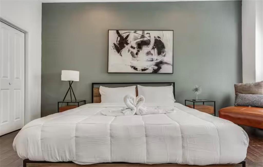 4050 Washington Road East Point, GA 30344 - Photo 9 of 58 a bedroom with a bed and painting on the wall