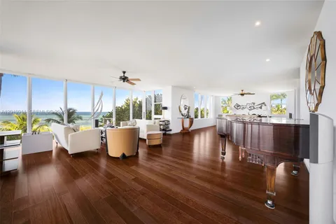 a living room with couches and a coffee table with wooden floor