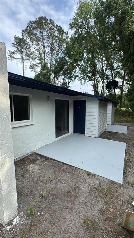 836 Southwest 64th Terrace, Unit C Gainesville, FL 32607 - Photo 4 of 13 a house view with a outdoor space