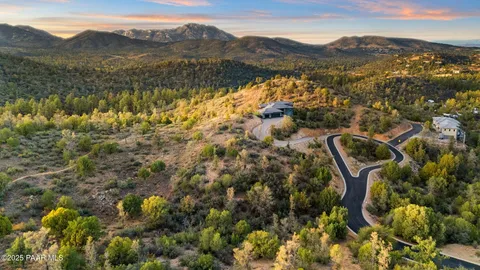 a view of a town with mountains in the background