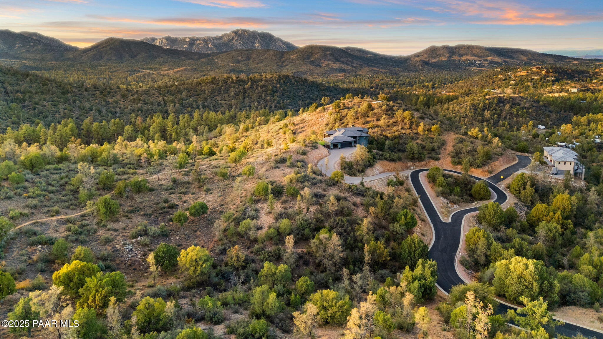 a view of a town with mountains in the background