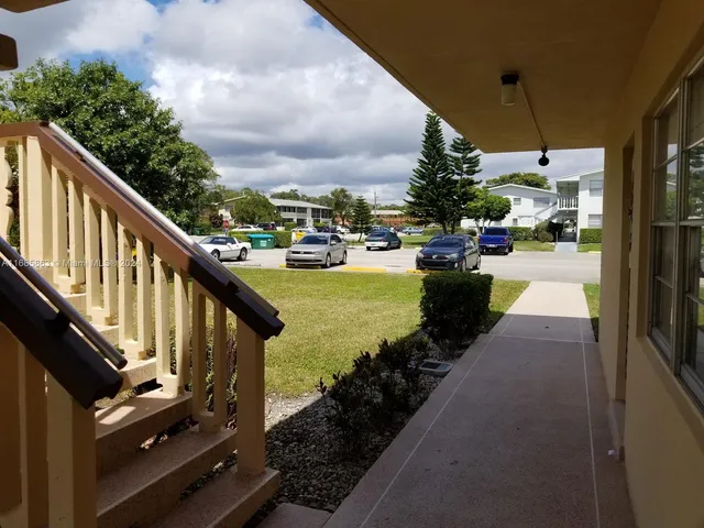 a view of a balcony with chairs