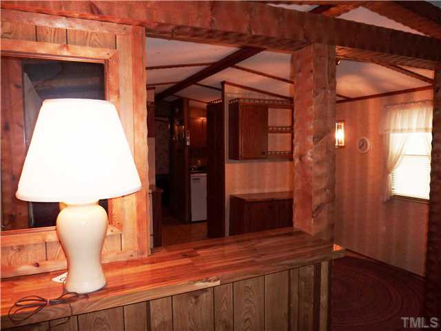 520 Billy Burwell Road Henderson, NC 27537 - Photo 3 of 11 a dining room with a table and chairs