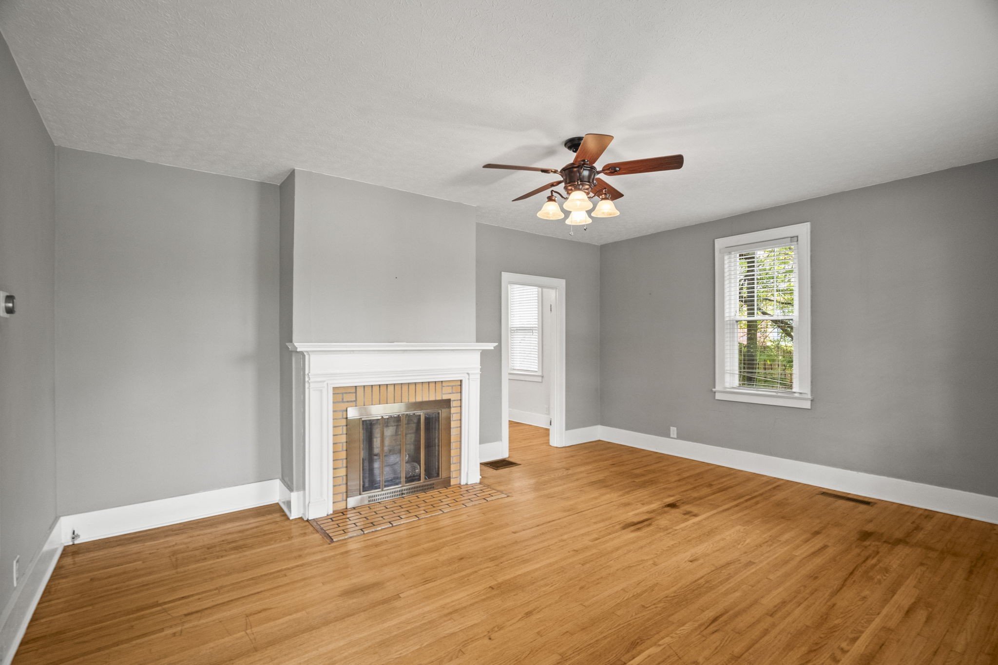 400 Connell Street Springfield, TN 37172 - Photo 3 of 53 a view of an empty room with window and a fireplace