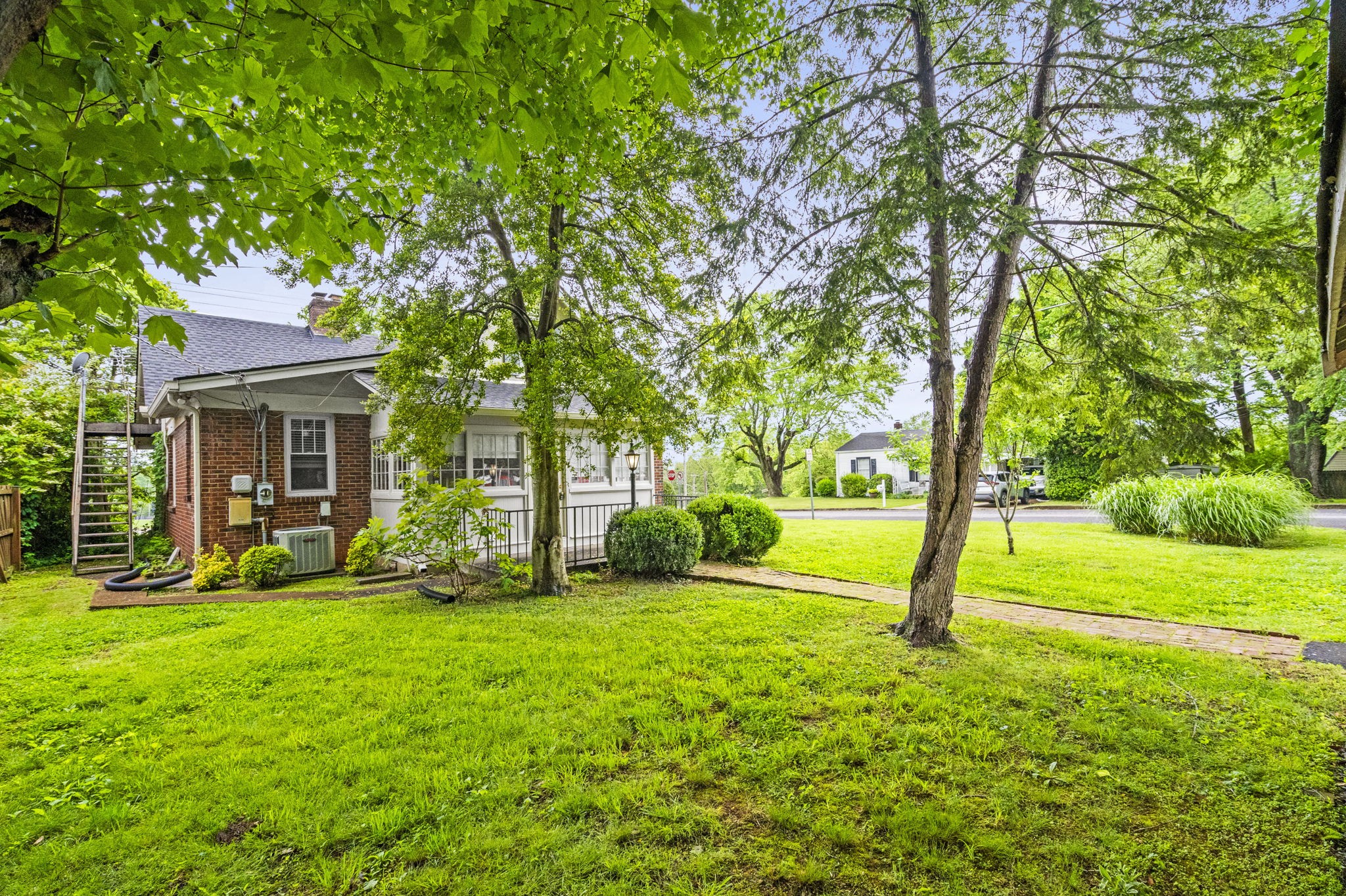 400 Connell Street Springfield, TN 37172 - Photo 39 of 53 a view of a backyard with large trees and plants